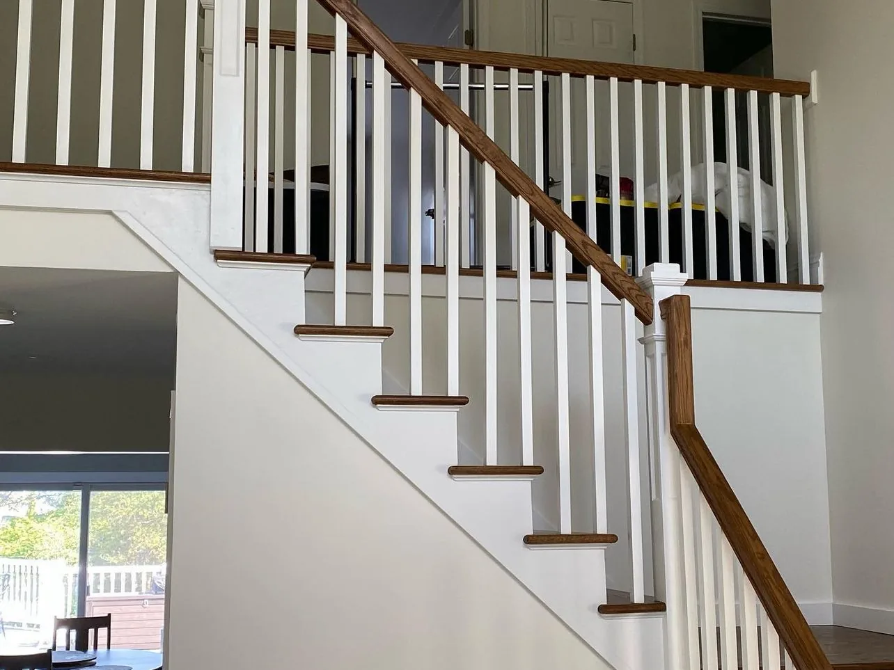 Complete staircase with oak handrail, white balusters and oak treads